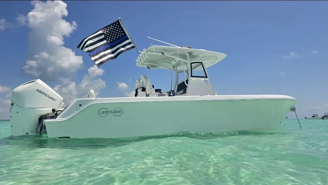Limitless Model 270 anchored in clear shallow water