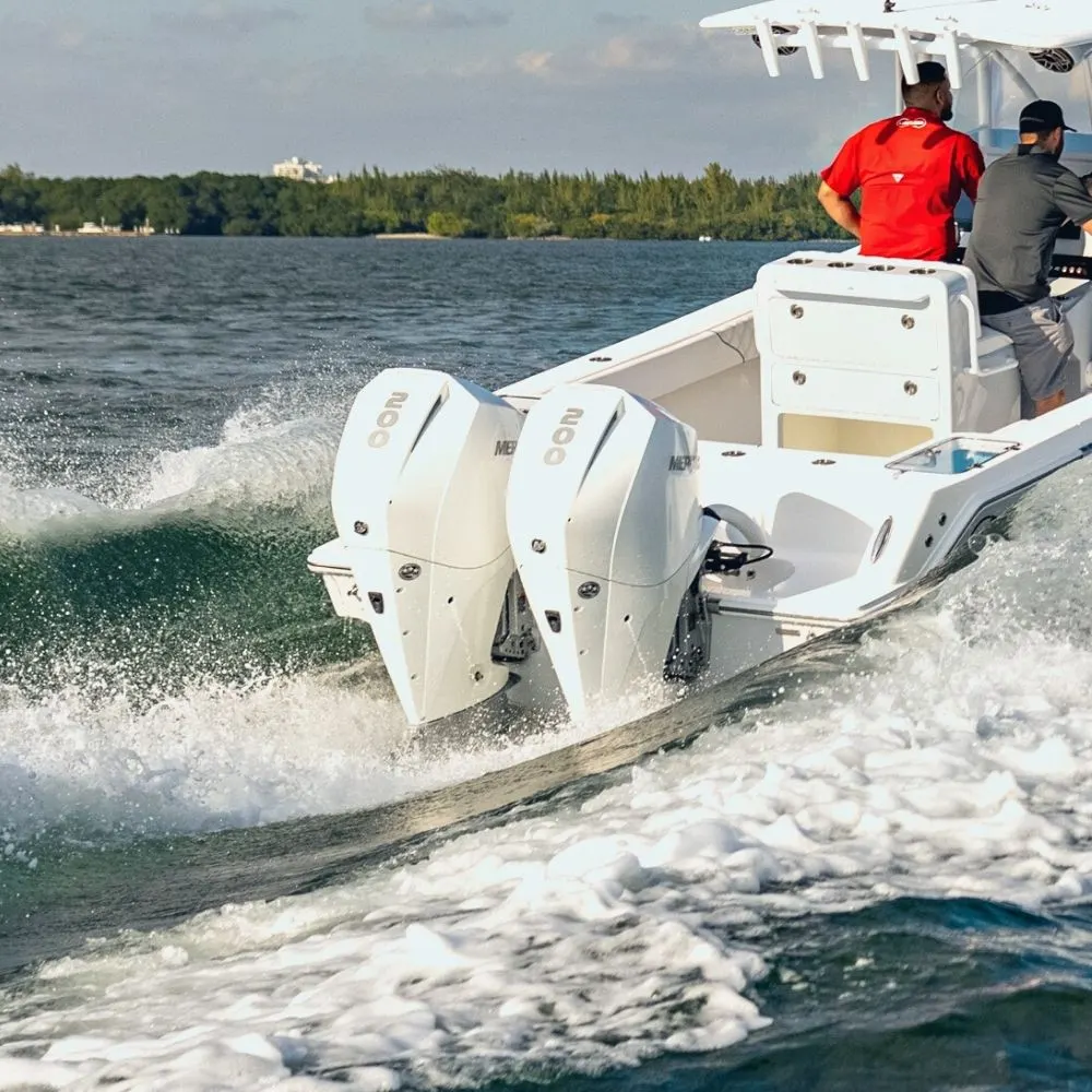 Twin Mercury outboards throwing a wake
